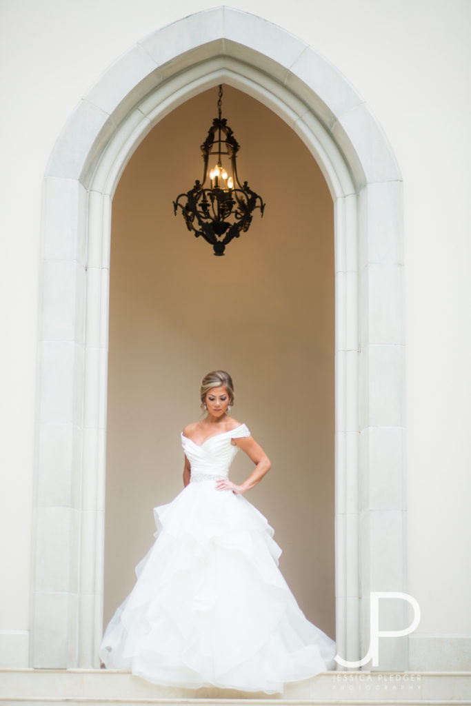 Bride in archway at Chateau Cocomar