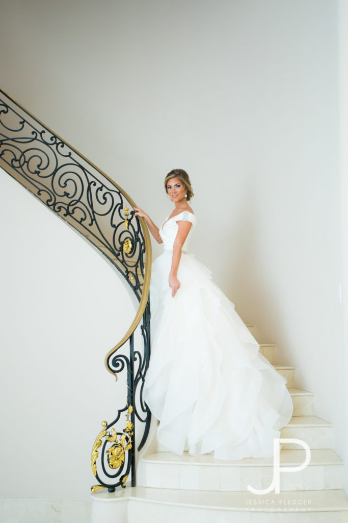 Bride on stairway at Chateau Cocomar