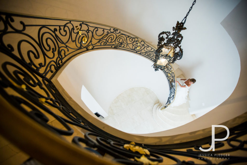 Bride on stairway at Chateau Cocomar