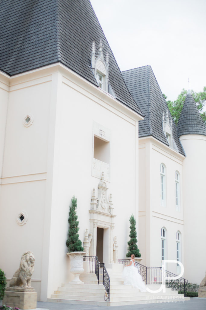 Bride on steps at Chateau Cocomar